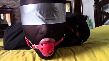Play Laura XXX is wearing panthyhose and high heels. She's hogtied, masked, blindfolded and ballgagged